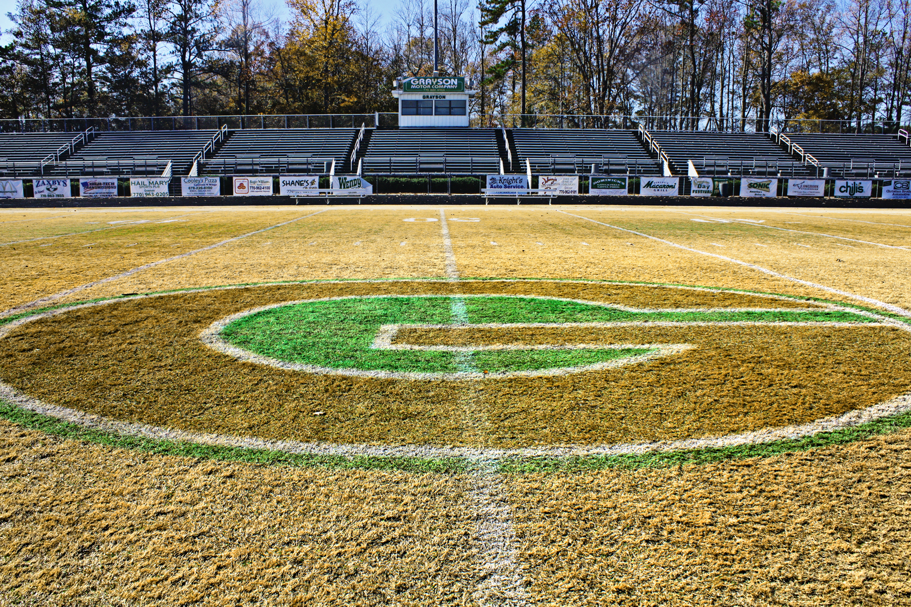 Football field with "G" painted on it.